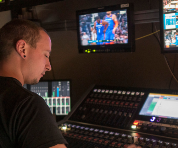 Myles Carlyle, Audio Engineer at Dome Productions and Maple Leaf Sports & Entertainment mixing on a Calrec Brio